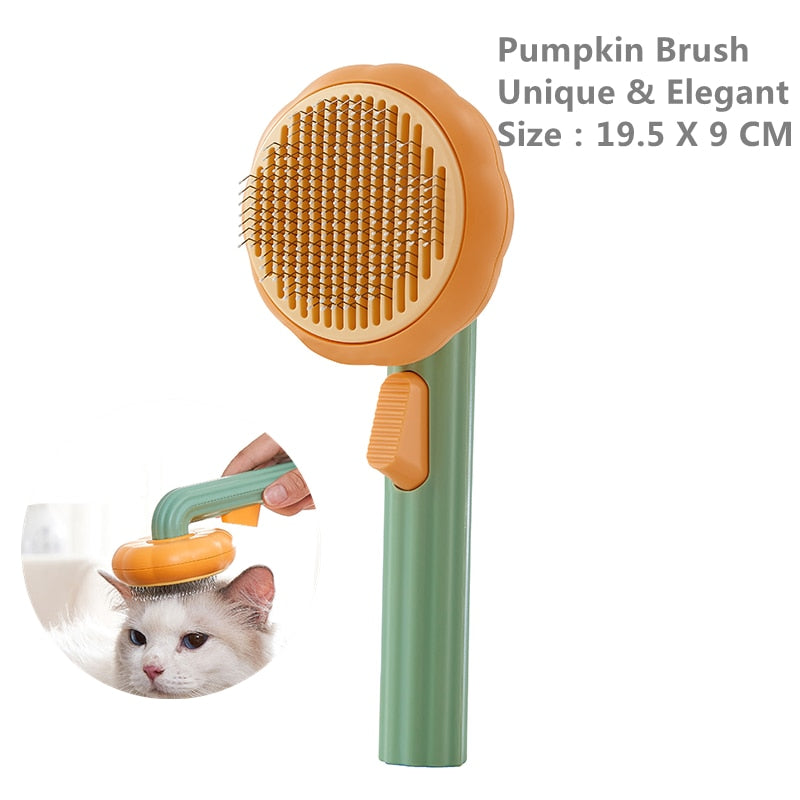 Orange pumpkin-shaped pet brush with green handle