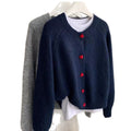 Navy cropped cardigan with red heart-shaped buttons