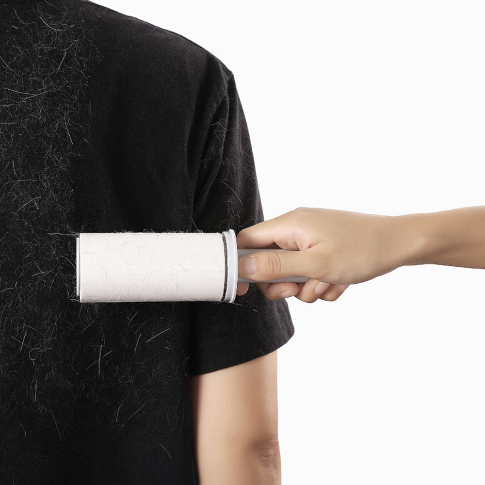 White pet hair roller used on black clothing