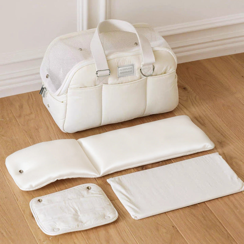 Cream pet carrier bag with padded accessories