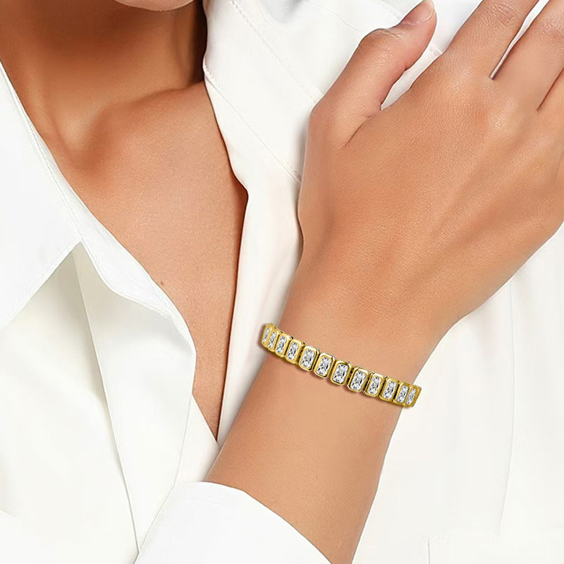 Gold-tone square-stone bracelet shown on a wrist