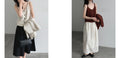 Three models wearing sleeveless tops with coordinated layers