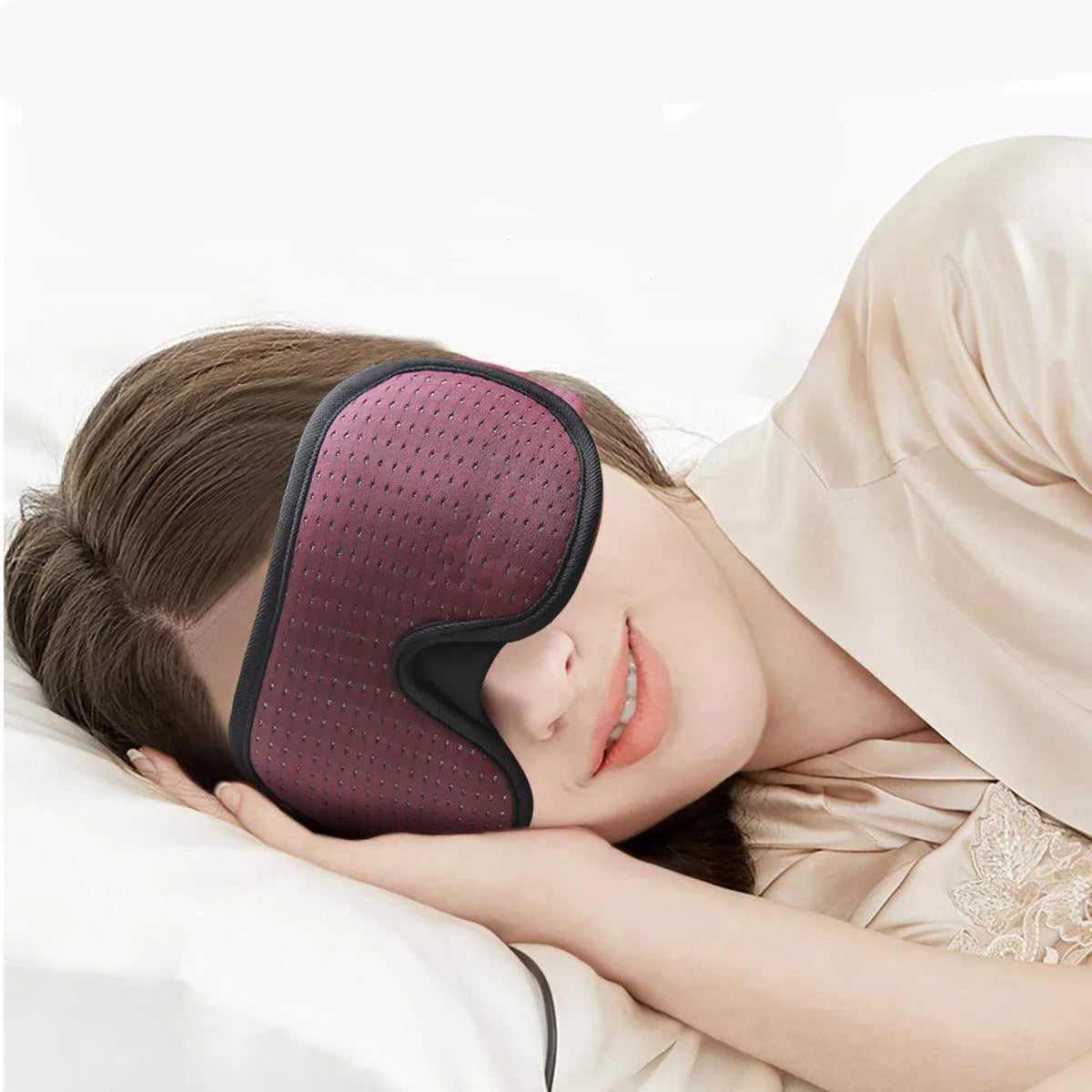 Sleeping model wearing a dark contoured eye mask