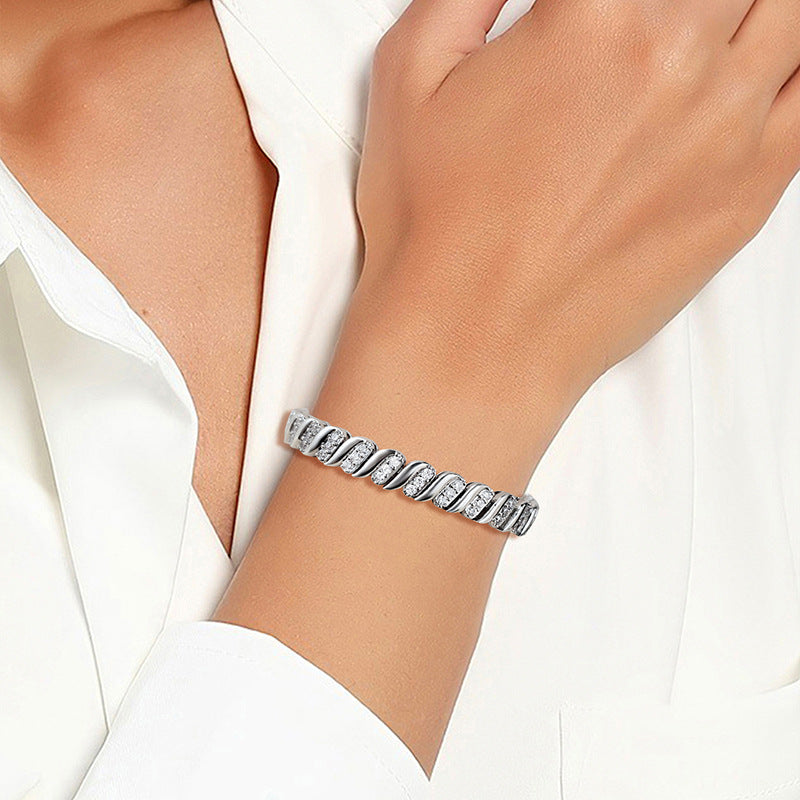 Silver-tone Cuban chain bracelet shown on a wrist