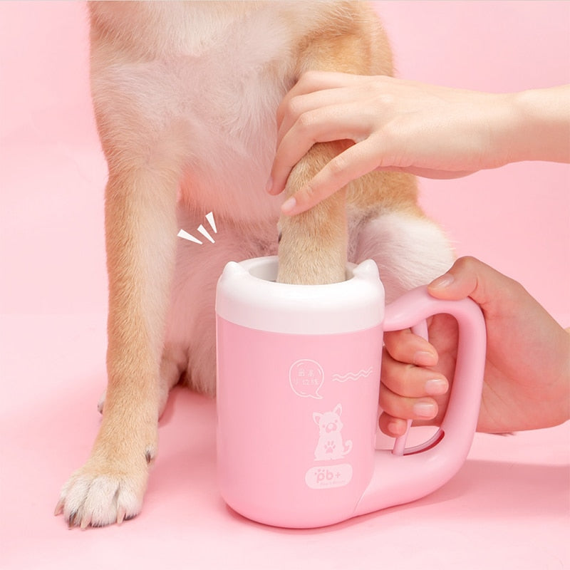 Pink paw-cleaning cup in use