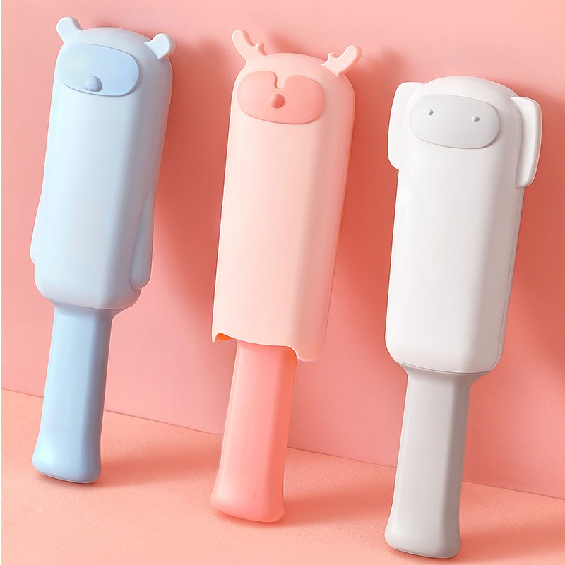 Pastel handled pet hair brushes with protective covers