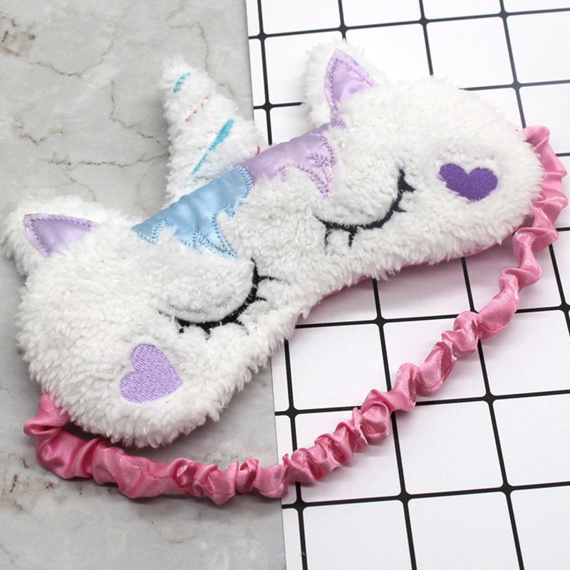 Plush unicorn sleep masks with embroidered closed eyes