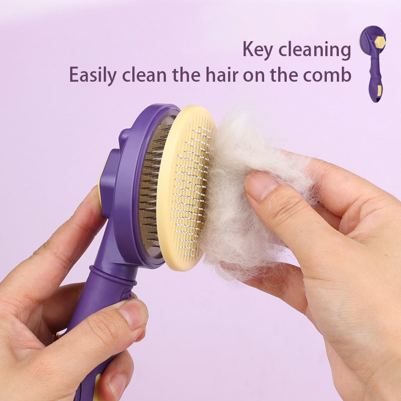 Purple-and-yellow grooming brush being cleared of hair