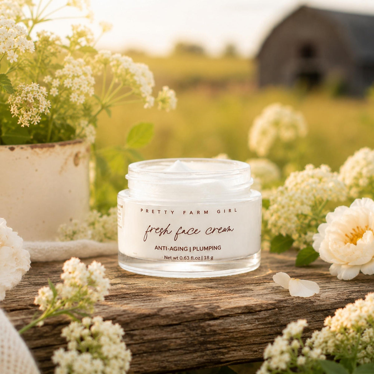 Fresh Face cream jar among flowers on a wooden table
