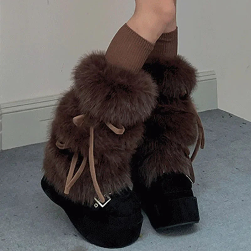 Brown plush bow leg warmers worn over black shoes