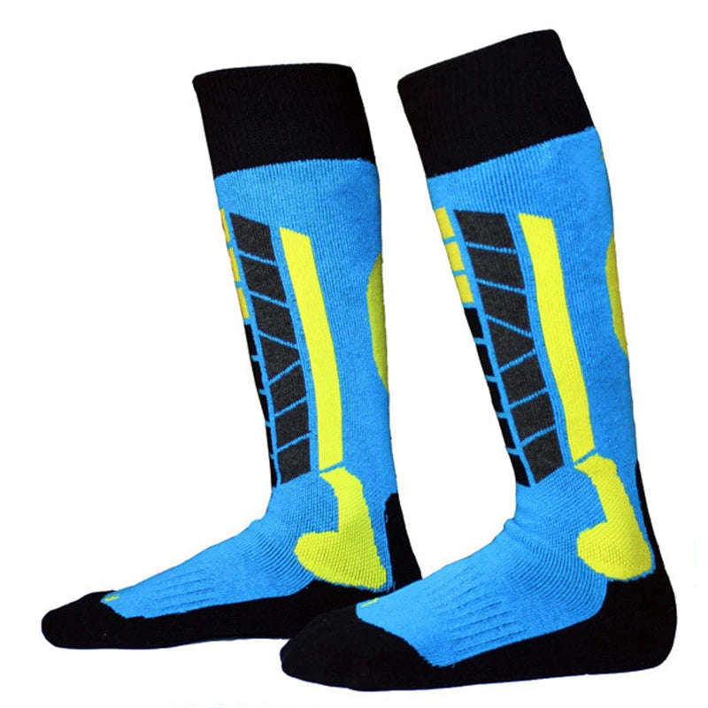 Blue knee-high ski socks with yellow and green panels